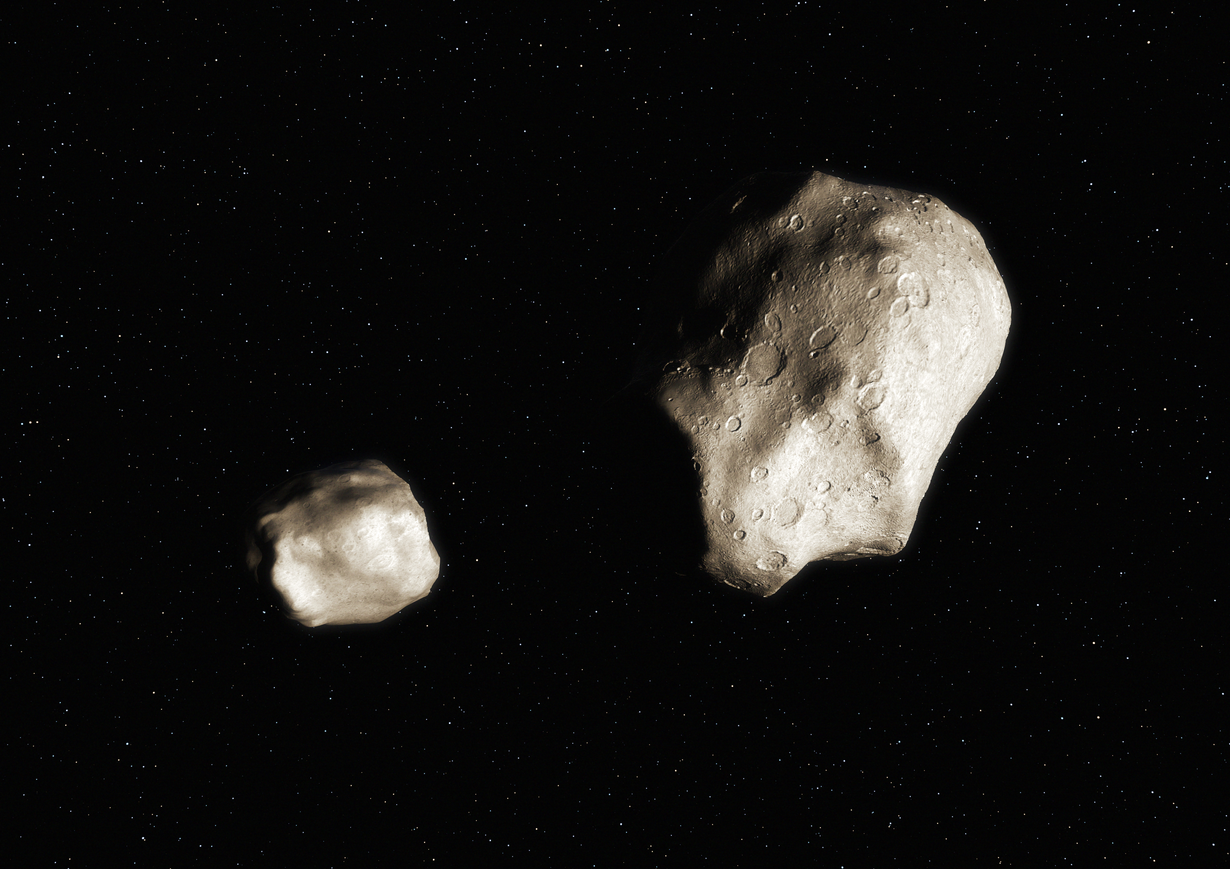 Artistic view of an asteroid pair during its transient proto-binary phase which happened less than 1 million years ago. Typically for this unstable proto-binary system, the primary has a diameter of a few kilometers, while the companion is 60% the primary size or less. Shortly after its formation, the secondary will gently escape forming an asteroid pair which will share the same orbits around the sun. (credit: ESO//L. Calçada)