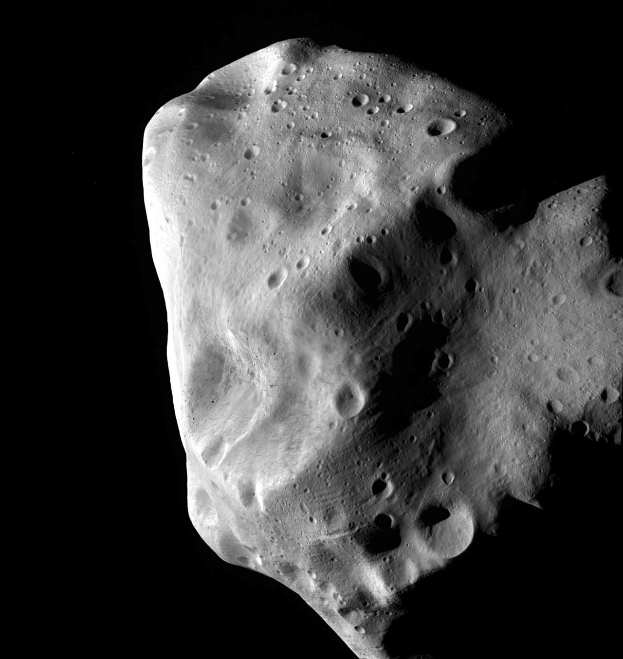 This image of the unusual asteroid Lutetia was taken by ESA’s Rosetta probe during its closest approach in July 2010. Lutetia, which is about 100 kilometres across, seems to be a leftover fragment of the same original material that formed the Earth, Venus and Mercury. It is now part of the main asteroid belt, between the orbits of Mars and Jupiter, but its composition suggests that it was originally much closer to the Sun. Credit: ESA 2010 MPS for OSIRIS Team MPS/UPD/LAM/IAA/RSSD/INTA/UPM/DASP/IDA